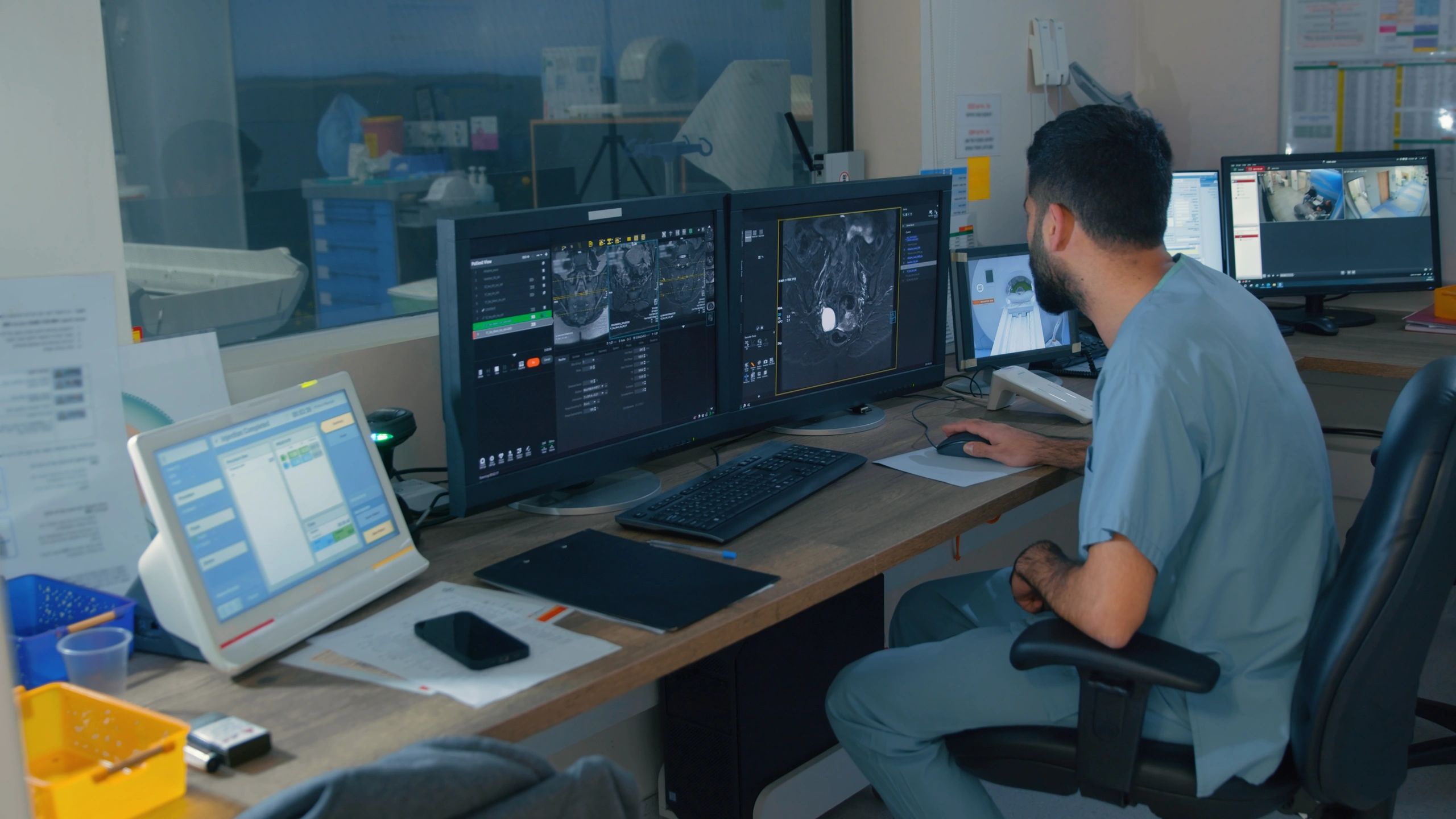 Medical specialist reviewing diagnostic imaging in a clinical setting